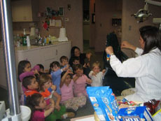 Dr Emma Teaching Nursery School kids about dental care